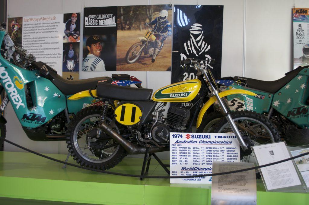 CAPTION: There was a tribute to Andy Cathelcutt the day we went through, with a couple of his Dakar bikes and this Andy-autographed TM400 front-and-centre. 