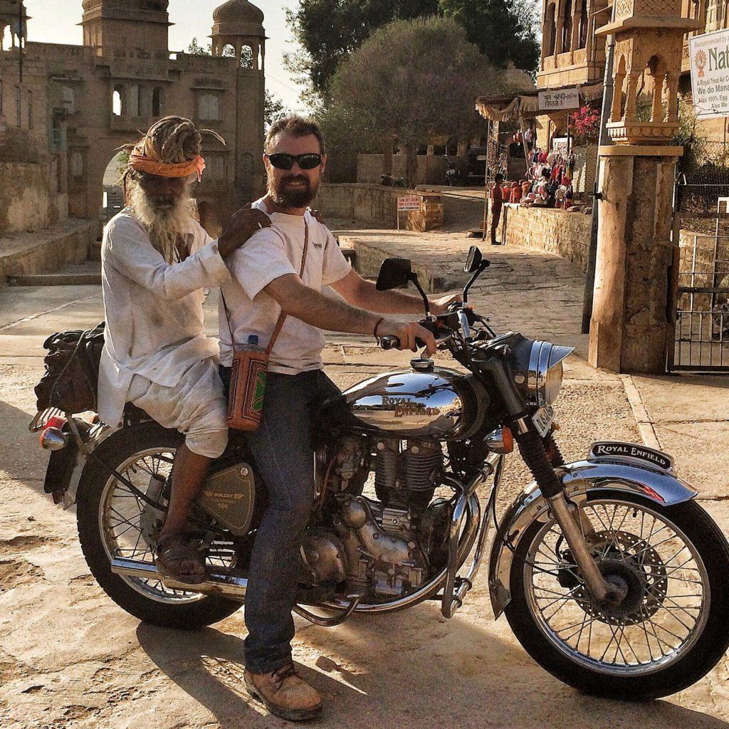 CAPTION: You meet the nicest people on an Enfield. Especially in India. Matt's pillion is a wandering, cannabis-smoking Hindu holy man. Apparently he used to play basketball at an international level for India. Pic courtesy of Nevermind Adventures, 2012.